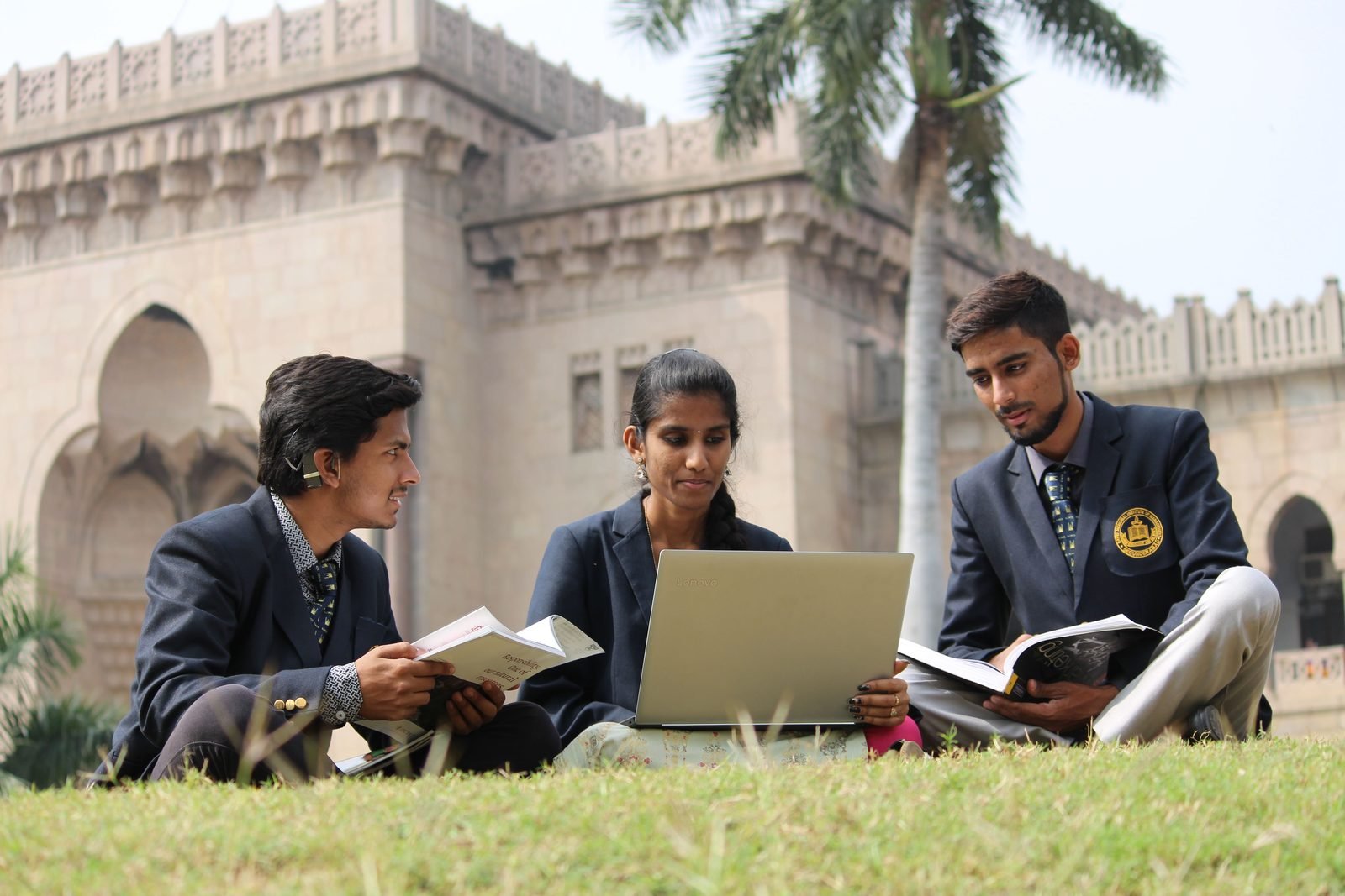 Indian students learning together with a laptop on campus